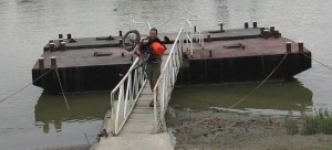 Zach has to carry his trike along the narrow gangway