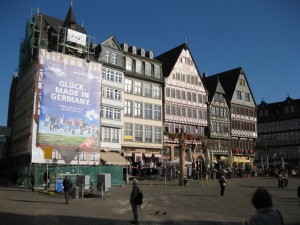 Picturesque buildings in Frankfurt, juxtaposed with a giant billboard