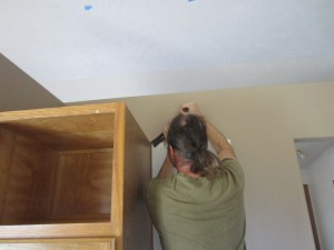 prying out cabinet